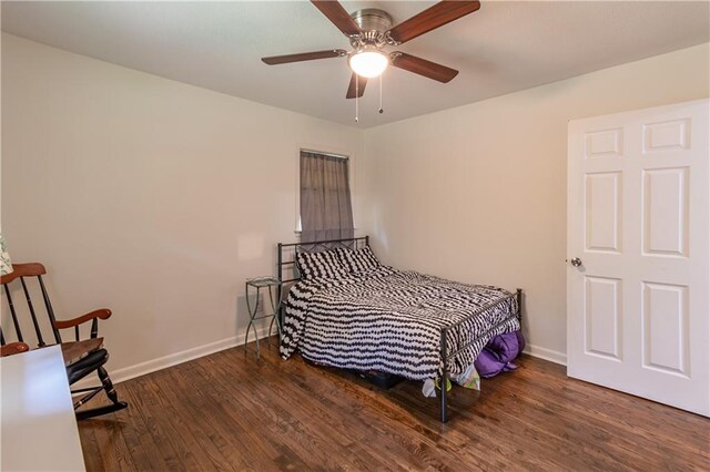 bedroom with dark wood-type flooring and ceiling fan