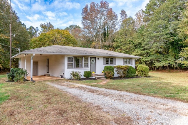 ranch-style home with a front lawn