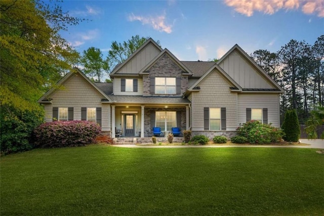 229 Primstone Way, Mcdonough, GA 30253 - craftsman house featuring board and batten siding, a lawn, a porch, and stone siding