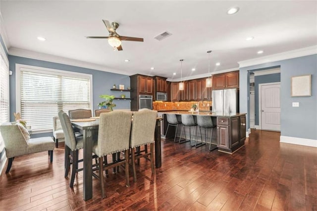 229 Primstone Way, Mcdonough, GA 30253 - dining room featuring ornamental molding, dark wood-style floors, recessed lighting, a ceiling fan, and baseboards