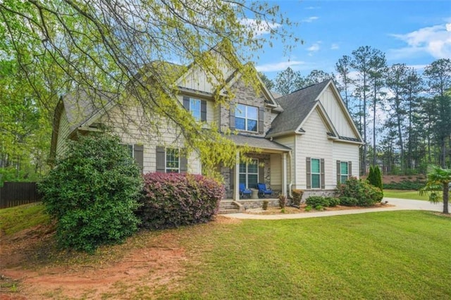 229 Primstone Way, Mcdonough, GA 30253 - craftsman-style home with covered porch, board and batten siding, and a front yard