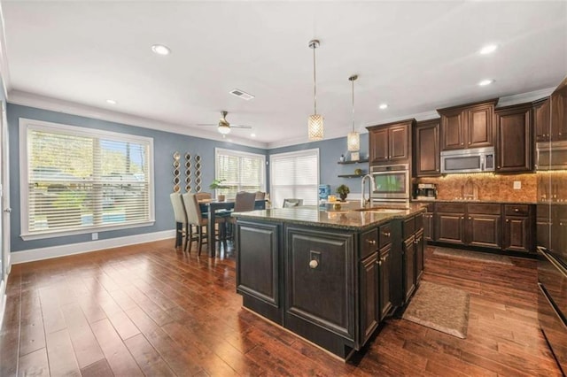 229 Primstone Way, Mcdonough, GA 30253 - kitchen featuring stainless steel appliances, a sink, baseboards, ceiling fan, and tasteful backsplash