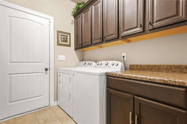 229 Primstone Way, Mcdonough, GA 30253 - laundry area with washer and clothes dryer, cabinet space, and light tile patterned flooring