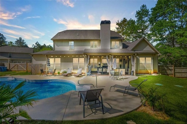 229 Primstone Way, Mcdonough, GA 30253 - rear view of property featuring a gate, a fenced backyard, a patio, and a chimney