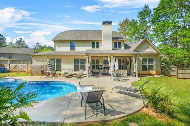 229 Primstone Way, Mcdonough, GA 30253 - back of house with a patio area, a chimney, and a gate