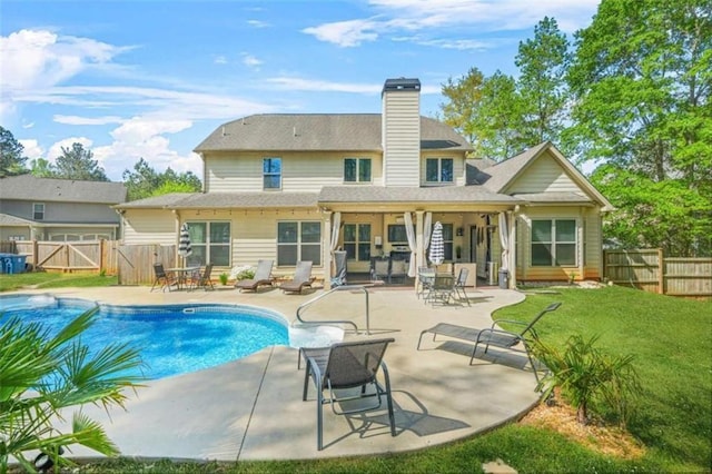 229 Primstone Way, Mcdonough, GA 30253 - back of property featuring a gate, a fenced backyard, a patio area, and a chimney