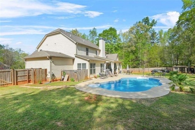 229 Primstone Way, Mcdonough, GA 30253 - rear view of property with a chimney and a patio