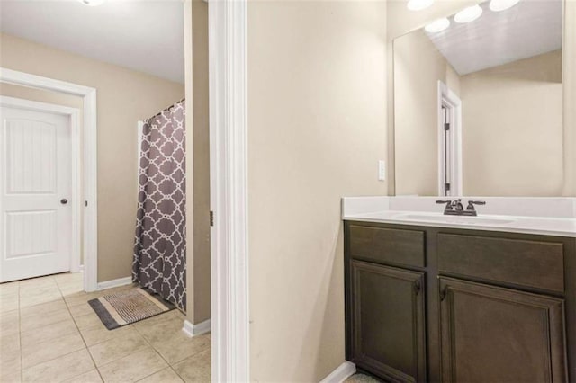 229 Primstone Way, Mcdonough, GA 30253 - full bath with vanity, tile patterned flooring, baseboards, and a shower with shower curtain