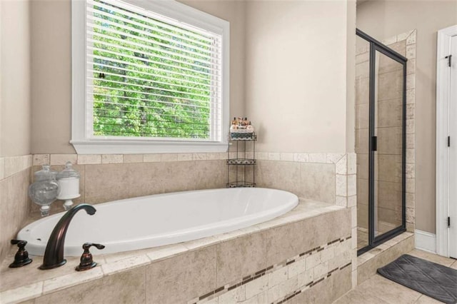 229 Primstone Way, Mcdonough, GA 30253 - full bathroom featuring a shower stall, a bath, and tile patterned floors