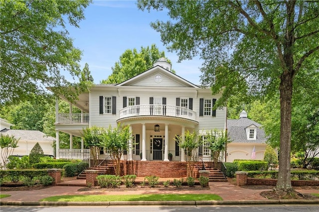 8643 Ellard Dr, Alpharetta, GA 30022 - neoclassical / greek revival house with a balcony, a porch, a chimney, and stairway