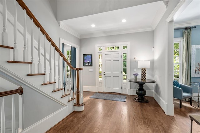 8643 Ellard Dr, Alpharetta, GA 30022 - entrance foyer with wood finished floors, crown molding, stairway, and recessed lighting