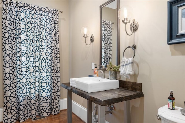 8643 Ellard Dr, Alpharetta, GA 30022 - bathroom with wood finished floors and curtained shower