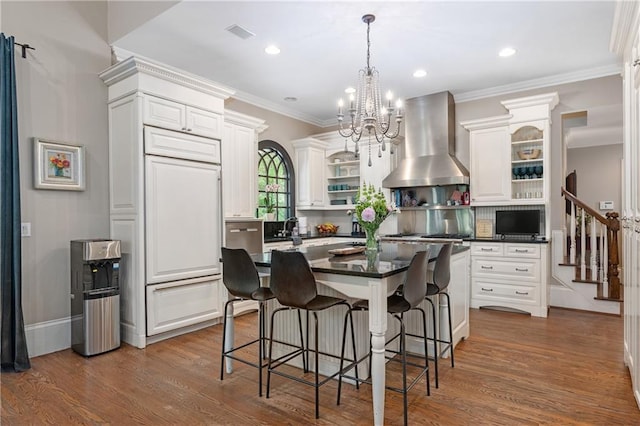 8643 Ellard Dr, Alpharetta, GA 30022 - kitchen featuring range hood, open shelves, dark countertops, white cabinets, and ornamental molding