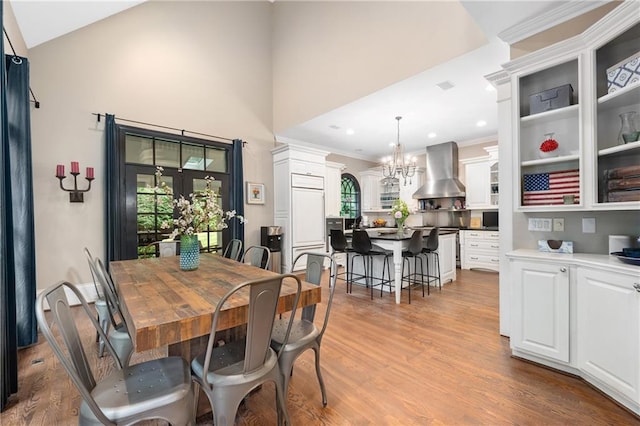 8643 Ellard Dr, Alpharetta, GA 30022 - dining area with plenty of natural light, light wood-style floors, a chandelier, high vaulted ceiling, and recessed lighting