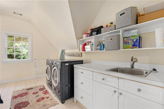 8643 Ellard Dr, Alpharetta, GA 30022 - laundry area featuring washer and dryer, cabinet space, and light tile patterned floors