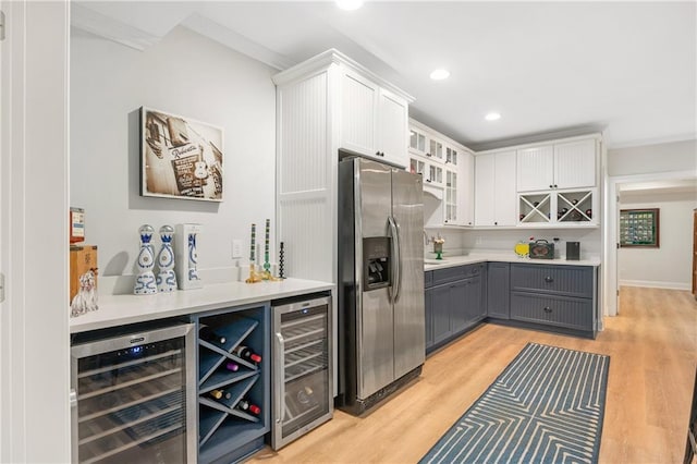 8643 Ellard Dr, Alpharetta, GA 30022 - indoor dry bar with stainless steel refrigerator with ice dispenser, wine cooler, crown molding, light wood-style flooring, and recessed lighting