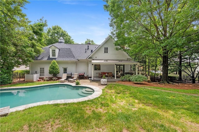 8643 Ellard Dr, Alpharetta, GA 30022 - back of house featuring an outdoor pool, a patio area, french doors, and a chimney