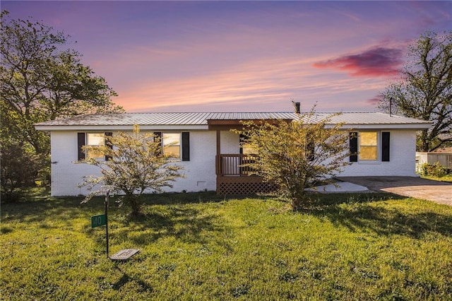 40 Kingston Dr, Comer, GA 30629 - ranch-style home with brick siding, a lawn, and metal roof