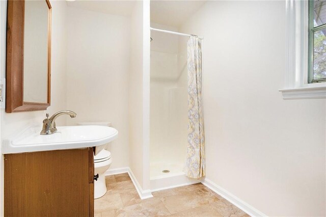40 Kingston Dr, Comer, GA 30629 - bathroom with vanity, baseboards, a shower stall, and toilet