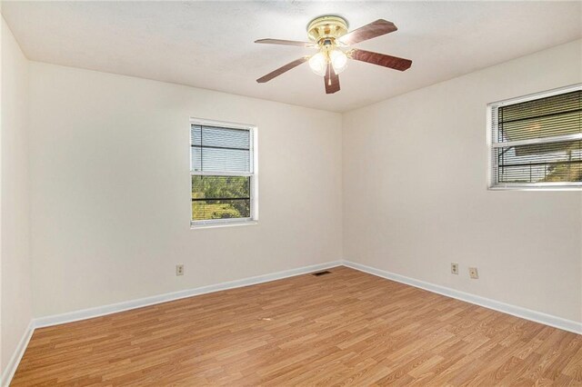 40 Kingston Dr, Comer, GA 30629 - spare room with light wood-type flooring, plenty of natural light, and a ceiling fan