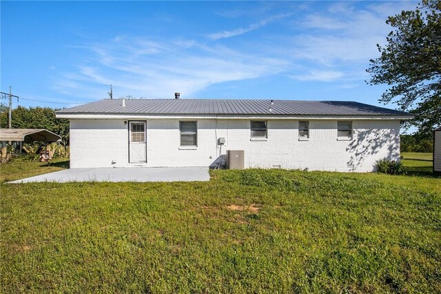 40 Kingston Dr, Comer, GA 30629 - back of property featuring a patio area, a lawn, and metal roof