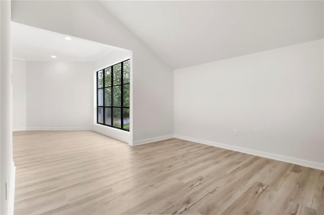 bonus room featuring light wood-style flooring, lofted ceiling, baseboards, and recessed lighting