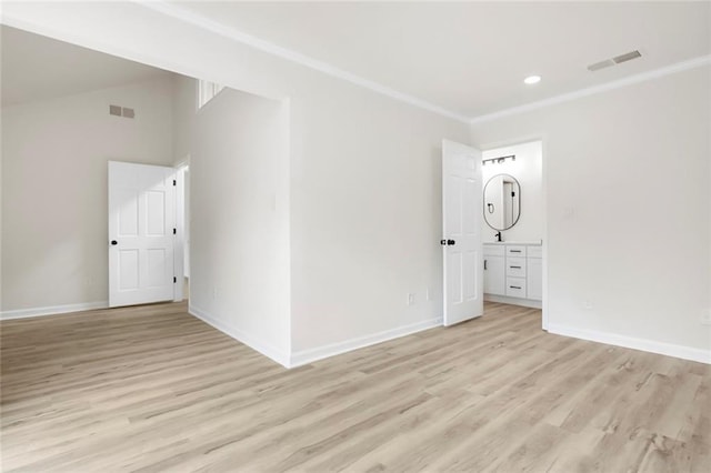 unfurnished room with light wood-style flooring, baseboards, crown molding, and recessed lighting