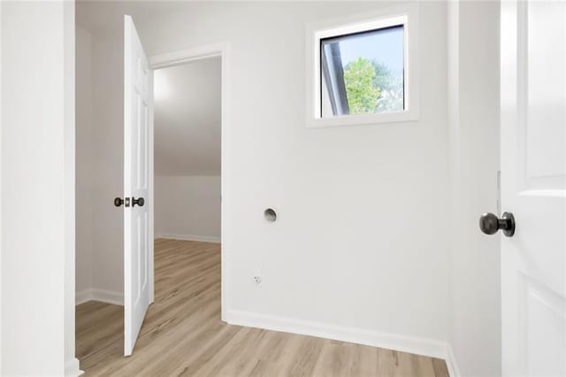 washroom featuring baseboards and light wood finished floors