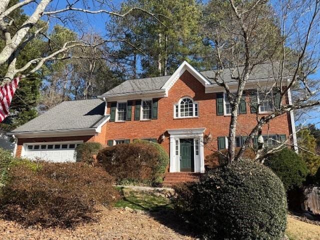 colonial inspired home with a garage