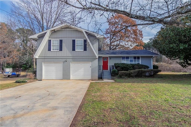 tri-level home with a front yard and a garage