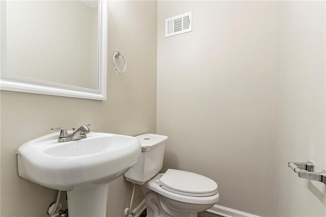 bathroom with sink and toilet