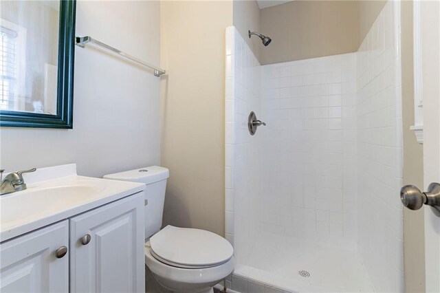 bathroom with vanity, toilet, and walk in shower