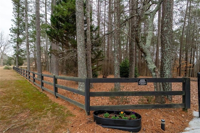 view of gate with fence