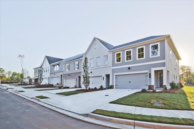 view of front of house featuring a garage and a front yard