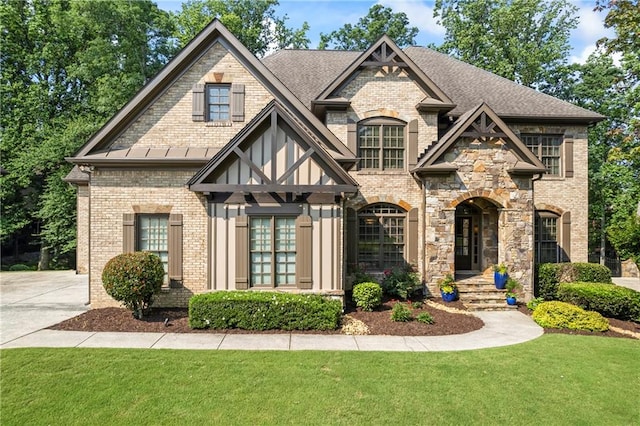 2517 Stone Manor Dr, Buford, GA 30519 - view of front facade featuring brick siding, a front yard, and roof with shingles