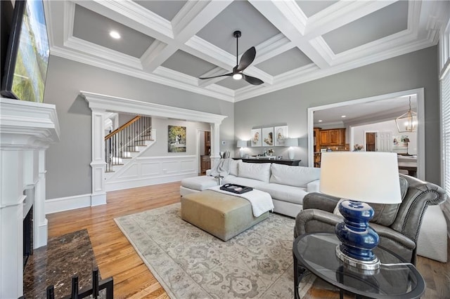 2517 Stone Manor Dr, Buford, GA 30519 - living area with ceiling fan, light wood-type flooring, coffered ceiling, ornamental molding, and stairway