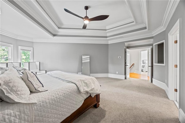 2517 Stone Manor Dr, Buford, GA 30519 - bedroom with a raised ceiling, light carpet, crown molding, baseboards, and a ceiling fan