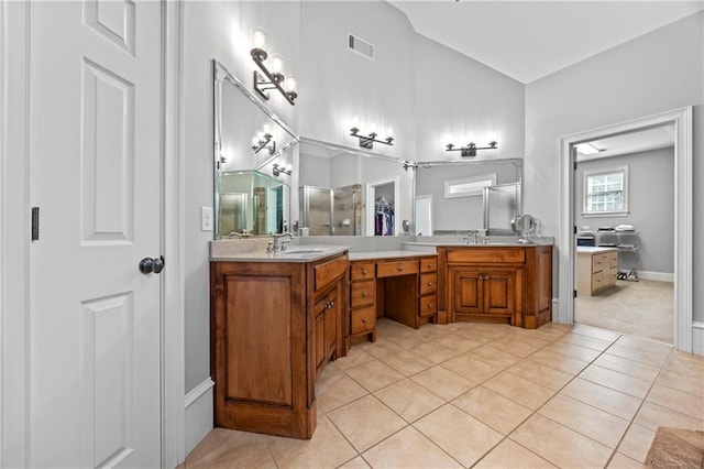 2517 Stone Manor Dr, Buford, GA 30519 - full bathroom with double vanity, tile patterned floors, a walk in closet, and baseboards