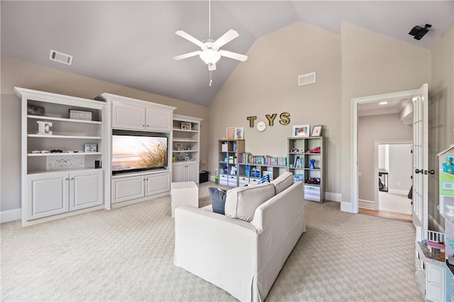 2517 Stone Manor Dr, Buford, GA 30519 - living area with light carpet, ceiling fan, high vaulted ceiling, and baseboards