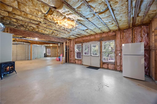2517 Stone Manor Dr, Buford, GA 30519 - basement with freestanding refrigerator and a wood stove