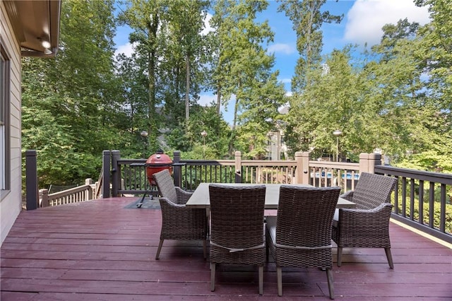 2517 Stone Manor Dr, Buford, GA 30519 - wooden deck featuring outdoor dining space and view of wooded area