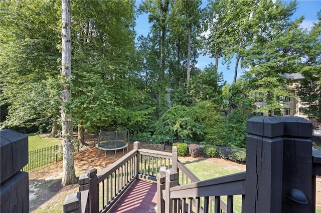 2517 Stone Manor Dr, Buford, GA 30519 - wooden deck with a trampoline and a fenced backyard