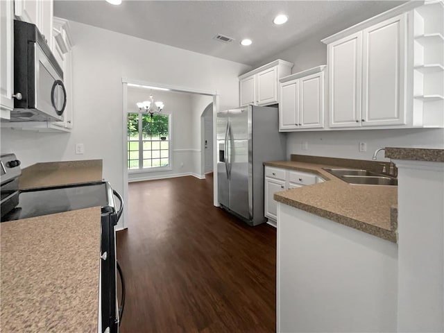 63 Couch Rd, Senoia, GA 30276 - kitchen with appliances with stainless steel finishes, a sink, open shelves, dark wood-type flooring, and white cabinets