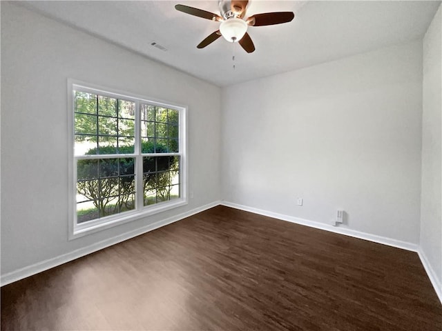 63 Couch Rd, Senoia, GA 30276 - empty room with dark wood-type flooring, baseboards, and a ceiling fan