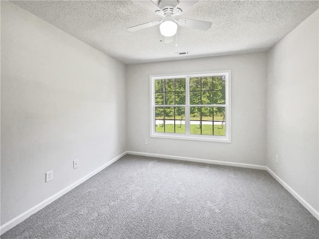 63 Couch Rd, Senoia, GA 30276 - empty room with ceiling fan, carpet, a textured ceiling, and baseboards