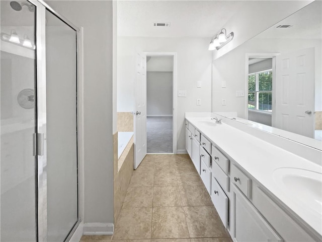 63 Couch Rd, Senoia, GA 30276 - full bathroom featuring double vanity, a stall shower, a bath, tile patterned flooring, and baseboards