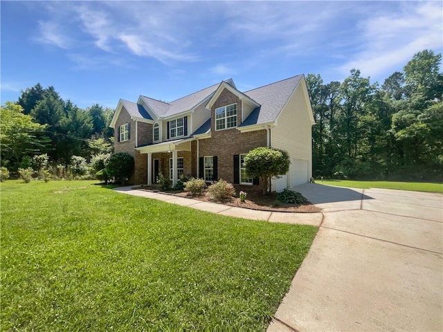63 Couch Rd, Senoia, GA 30276 - view of front facade with concrete driveway, an attached garage, brick siding, and a front yard