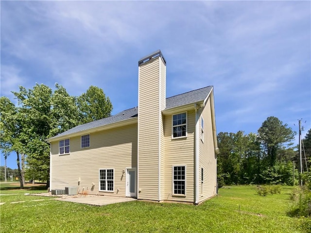 63 Couch Rd, Senoia, GA 30276 - back of property with a chimney, a patio, a yard, and central AC