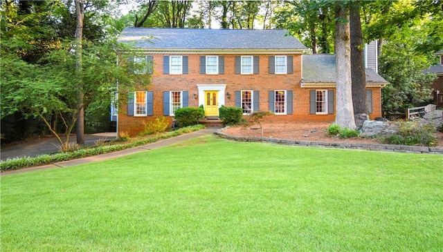 colonial home with a front yard