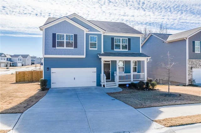 view of front of home with covered porch and a garage